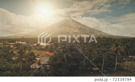 Sun cityscape of rural town at green volcano valley aerial. Contryside city streets at hillside Sun cityscape of rural town at green volcano valley aerial. Contryside city streets at hillside 72339794