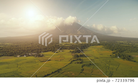 Aerial volcano erupt at sun light. Nobody nature landscape at Legazpi town, Mayon mount, Philippines 72339796