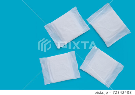 White sanitary pads on blue background. White sanitary pads on blue background. 72342408