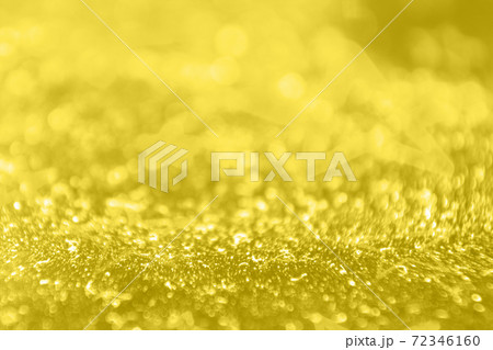 shining textured background in illuminating yellow color 72346160