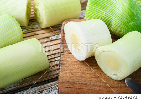 Green chopped leek sultan on choppong board over 72349273