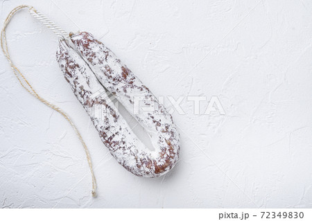 Salami sausage fuet on white background with space 72349830