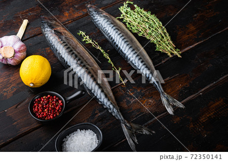 Mackerel with herbs on dark wooden background 72350141