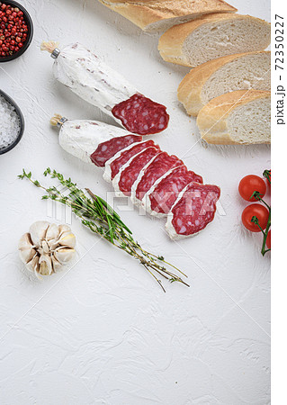 Spanish salcichon slices with panini and herbs on 72350227
