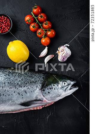 Fresh rainbow trout on black background, flat lay Fresh rainbow trout on black background, flat lay 72351865