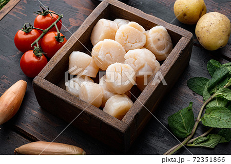 Fresh raw scallops ingredients for cooking, on dark wooden background 72351866