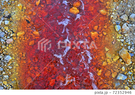 Pollution of a lake with contaminated water from a gold mine. 72352946