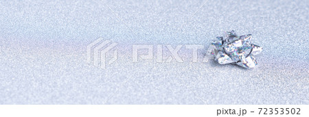 holographic bow on a shiny silver background 72353502
