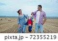 parenting, mother and father hold their son hands and throw up 72355219