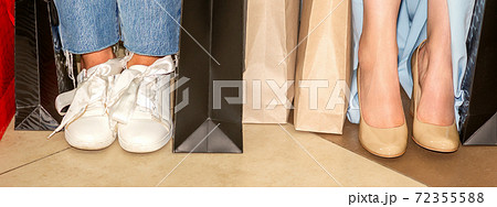 Feet of woman with shopping bags 72355588