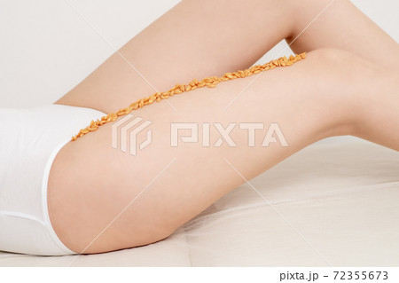 Wax beans in row on leg. 72355673