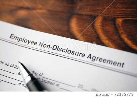 Legal document Employee Non-Disclosure Agreement on paper close up 72355775