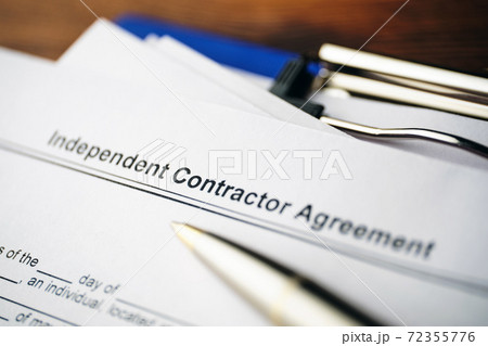 Legal document Independent Contractor Agreement on paper close up Legal document Independent Contractor Agreement on paper close up 72355776