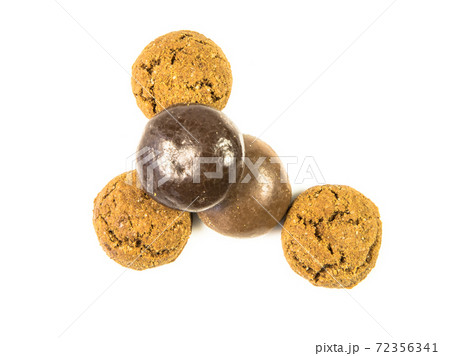 Pepernoten bunch of traditional and chocolate treats on white background Pepernoten bunch of traditional and chocolate treats on white background 72356341