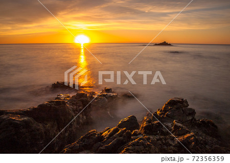 Orange sunrise over south pacific 72356359