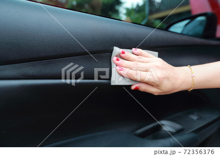 woman hand cleaning car 72356376