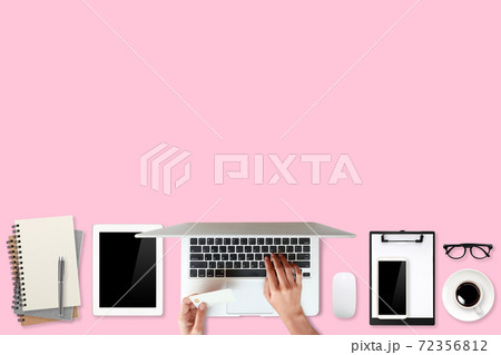 technology working table with woman hands on laptop computer, credit card, coffee cup and cell phone on pink background (or shopping and payment online concept) technology working table with woman hands on laptop computer, credit card, coffee cup and cell phone on pink background (or shopping and payment online concept) 72356812