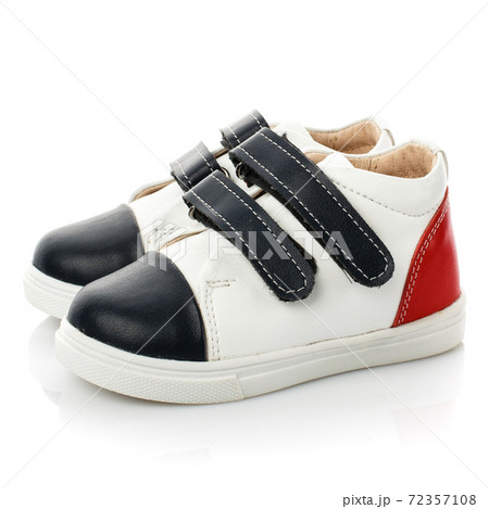 Black and white baby sneakers isolated on white background. Black and white baby sneakers isolated on white background. 72357108