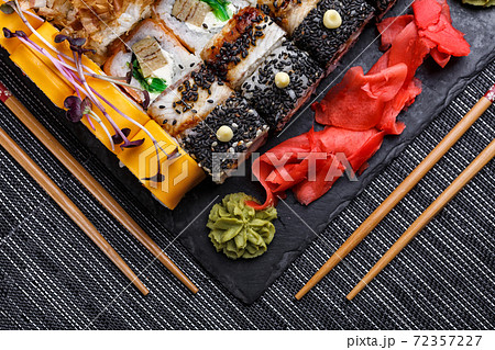 Japanese sushi food. Maki ands rolls with tuna, salmon, shrimp, crab and avocado. Top view of assorted sushi. 72357227