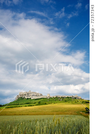 Spis Castle at sunny day with picturesque clouds, Slovakia. Spis Castle at sunny day with picturesque clouds, Slovakia. 72357343