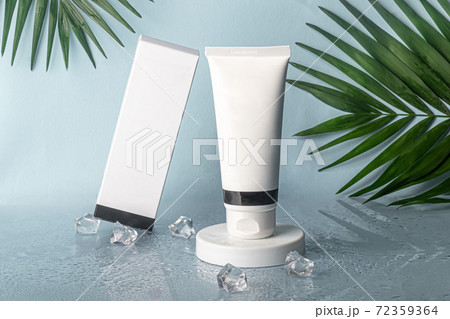 White plastic bottles for creams. On multi-colored backgrounds from Whatman paper. 72359364