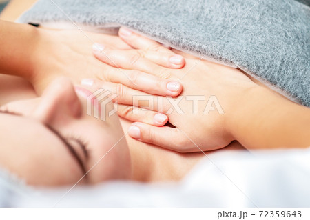 Chest massage of woman. 72359643