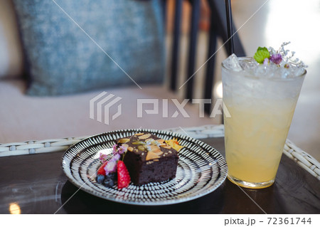 dark chocolate homemade keto vegan flourless brownie with lemon beverage drink dark chocolate homemade keto vegan flourless brownie with lemon beverage drink 72361744