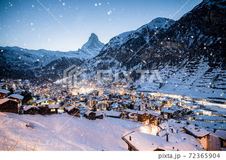 snowing in Zermatt traditional Swiss ski resort under the Matterhorn 72365904