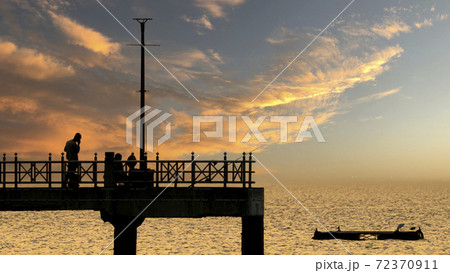 Bangsan Chonburi Thailand jetty and sunset. At Bangsan beach. Ao Thai Ocean. Beautiful sunset landscape, wooden shore jetty and colorful sky and cloud. Artistic beach sunset under wonderful sky. Recre 72370911