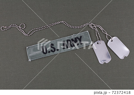 U.S. Army Branch Tape with dog tags on olive drab uniform 72372418