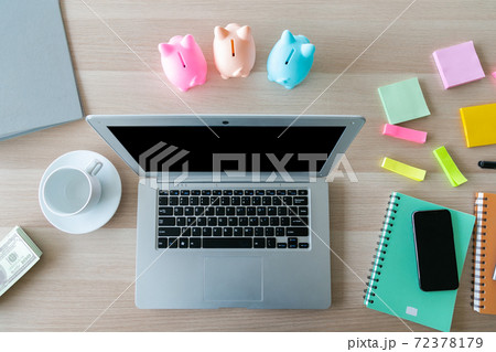 Modern office desk table with laptop, smartphone and other supplies with cup of coffee. Top view, flat lay. 72378179