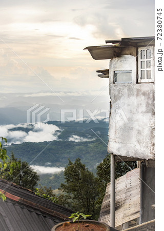 A fragment of a house overhanging a mountain valley on the island of Sri Lanka A fragment of a house overhanging a mountain valley on the island of Sri Lanka 72380745