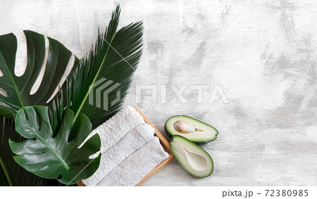 Spa. Body care items on a white background with tropical leaves. Summer accessories. Space for text. Spa. Body care items on a white background with tropical leaves. Summer accessories. Space for text. 72380985