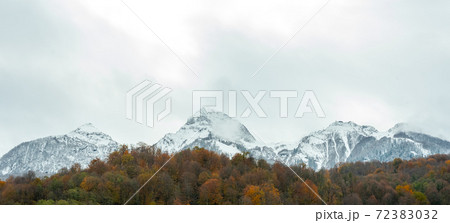Landscape of mountains with cloudy sky and fog on a cloudy day. Autumn rainy day 72383032