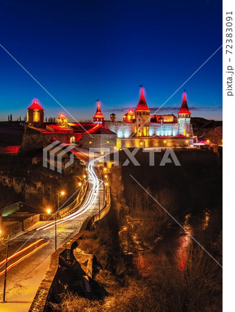 Kamianets-Podilskyi fortress on a winter night 72383091
