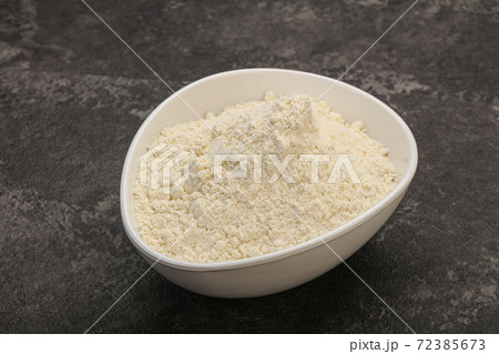 Wheat flour heap in the bowl Wheat flour heap in the bowl 72385673