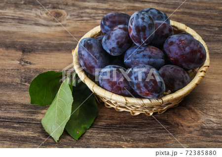 Ripe plum heap in the basket Ripe plum heap in the basket 72385880
