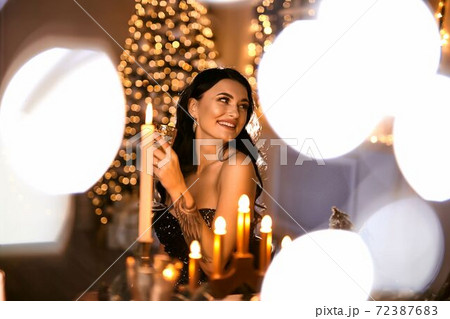 beautiful woman with a glass of sparkling wine 72387683