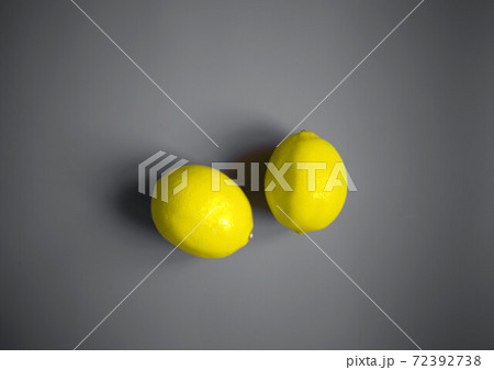 color concept of 2021. illuminating lemons on a ultimate gray background color concept of 2021. illuminating lemons on a ultimate gray background 72392738
