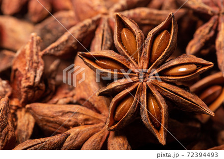 Heap of dried anise stars close-up view 72394493