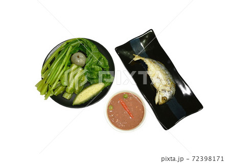 deep fried mackerel fish and spicy shrimp paste sauce eat with mixed boiled vegetable on plate 72398171