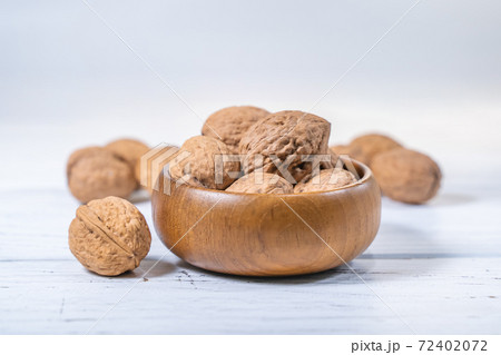 Walnuts kernels on white wooden desk, stock photo Walnuts kernels on white wooden desk, stock photo 72402072