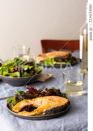 Fried salmon steak with salad Fried salmon steak with salad 72403990