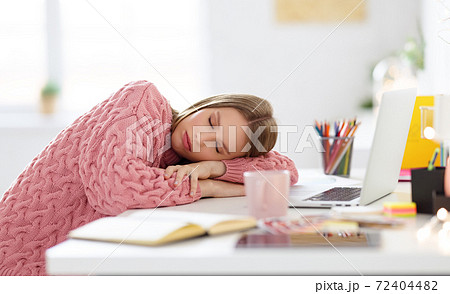 Tired freelancer sleeping during work at home Tired freelancer sleeping during work at home 72404482