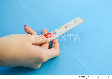Positive test result by using rapid test for COVID-19, quick fast antibody point of care testing. Lab performing rapid diagnostic test for antibodies to detect presence of antigens COVID-19 disease 72405254