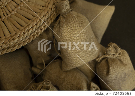 A hat and a mountain of bags with a place for text, for ecological natural products. 72405663