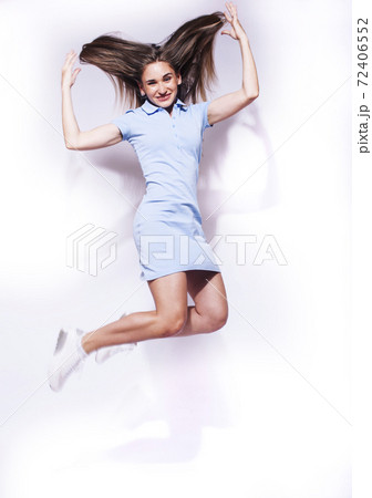 young pretty teenage girl jumping cheerful isolated on white background, lifestyle people concept 72406552