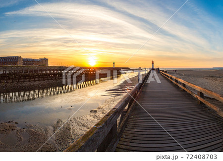 Wooden Pier and Lighthouse 72408703