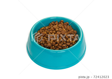 Cats and dogs dry food in the bowl isolated on white background. Cats and dogs dry food in the bowl isolated on white background. 72412023