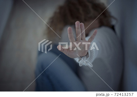 Violence on women concept at home - close up of woman hands to protect her - crime violented man and house danger situation for females - husband and wife crimes 72413257